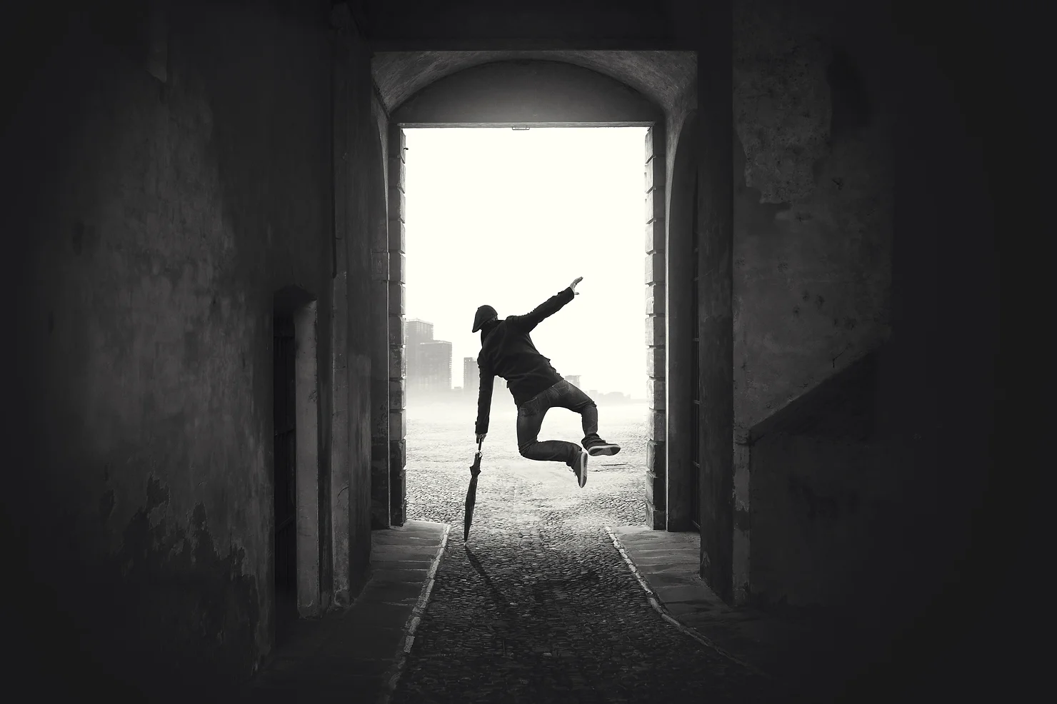 Black and white photo of someone clicking their heels