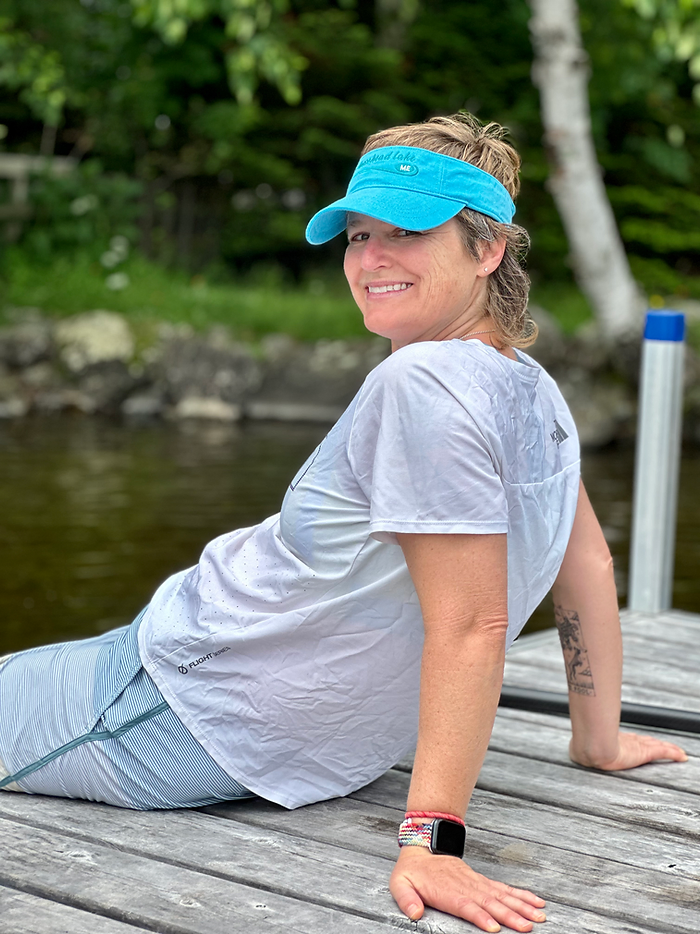 Photo of Molly Booker sitting on a dock