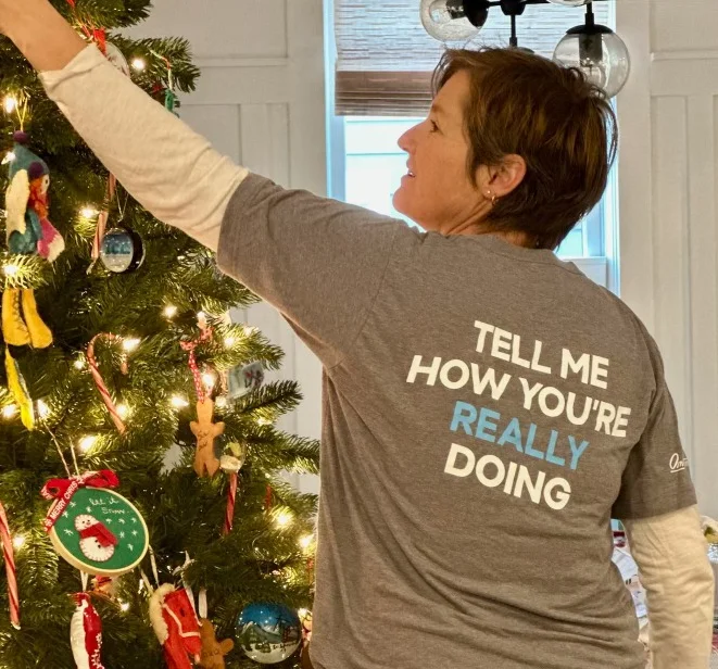 Photo of Molly Booker decorating a Christmas tree