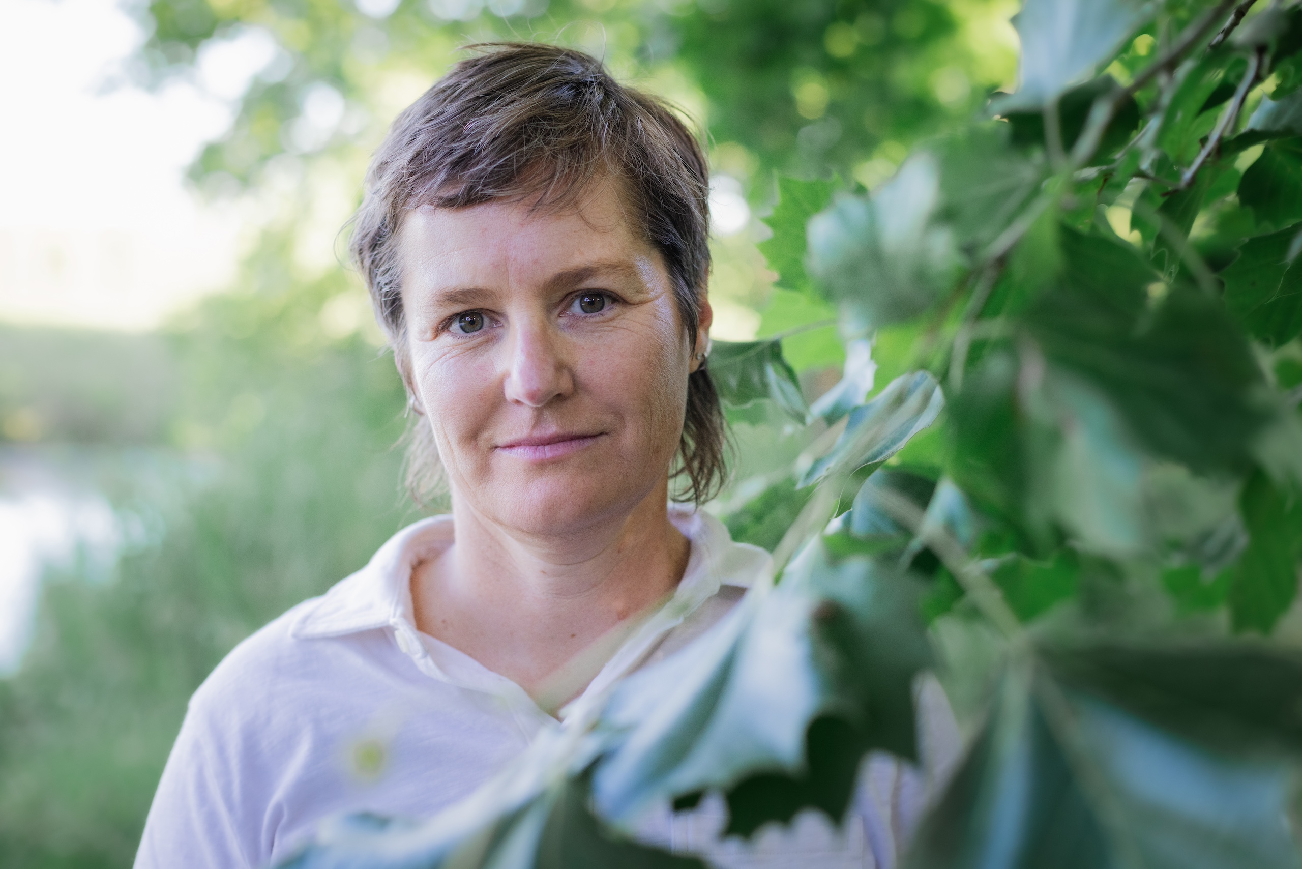 Photo of Molly Booker standing near a tree